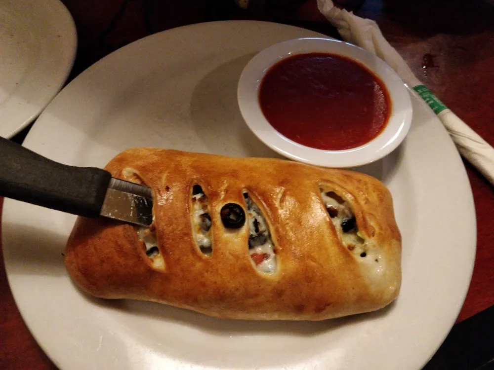 House Calzone with Pepperoni Beef Ham Mushrooms and Green Peppers